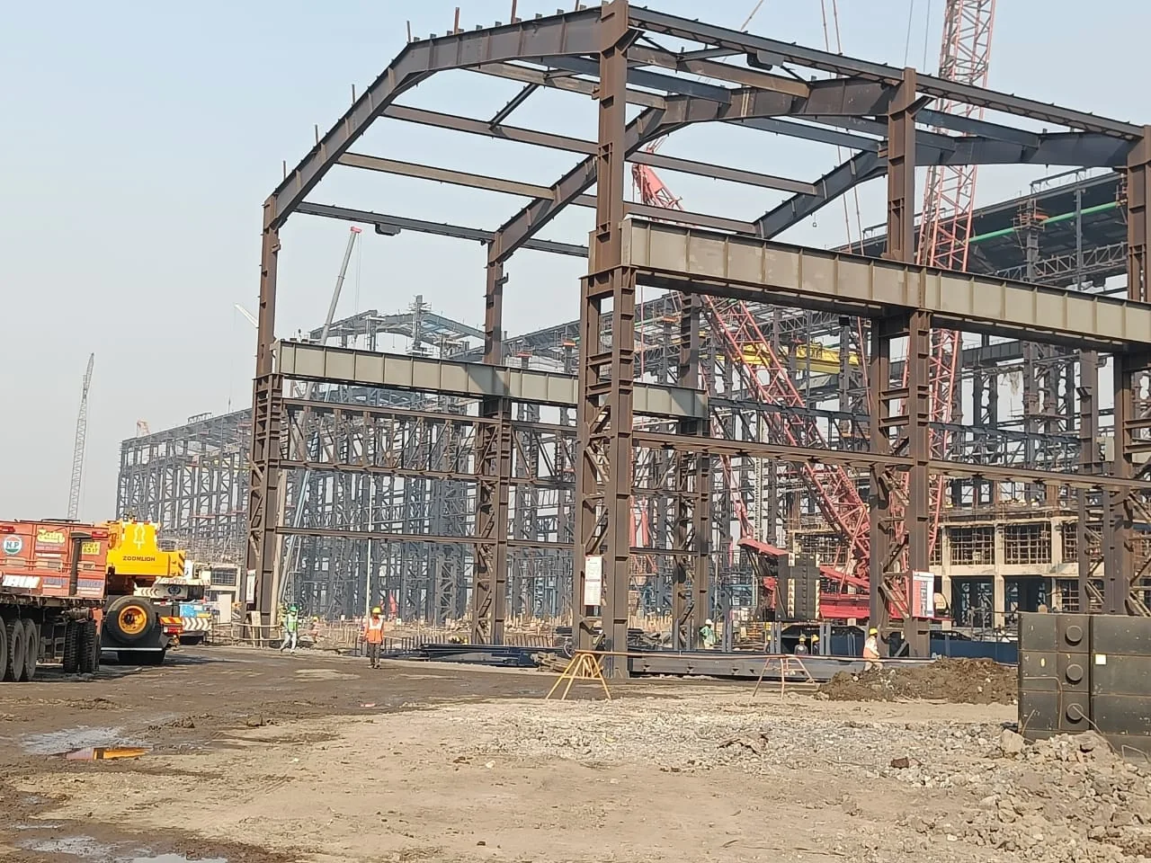 Pre-engineered building structure under erection at an industrial site